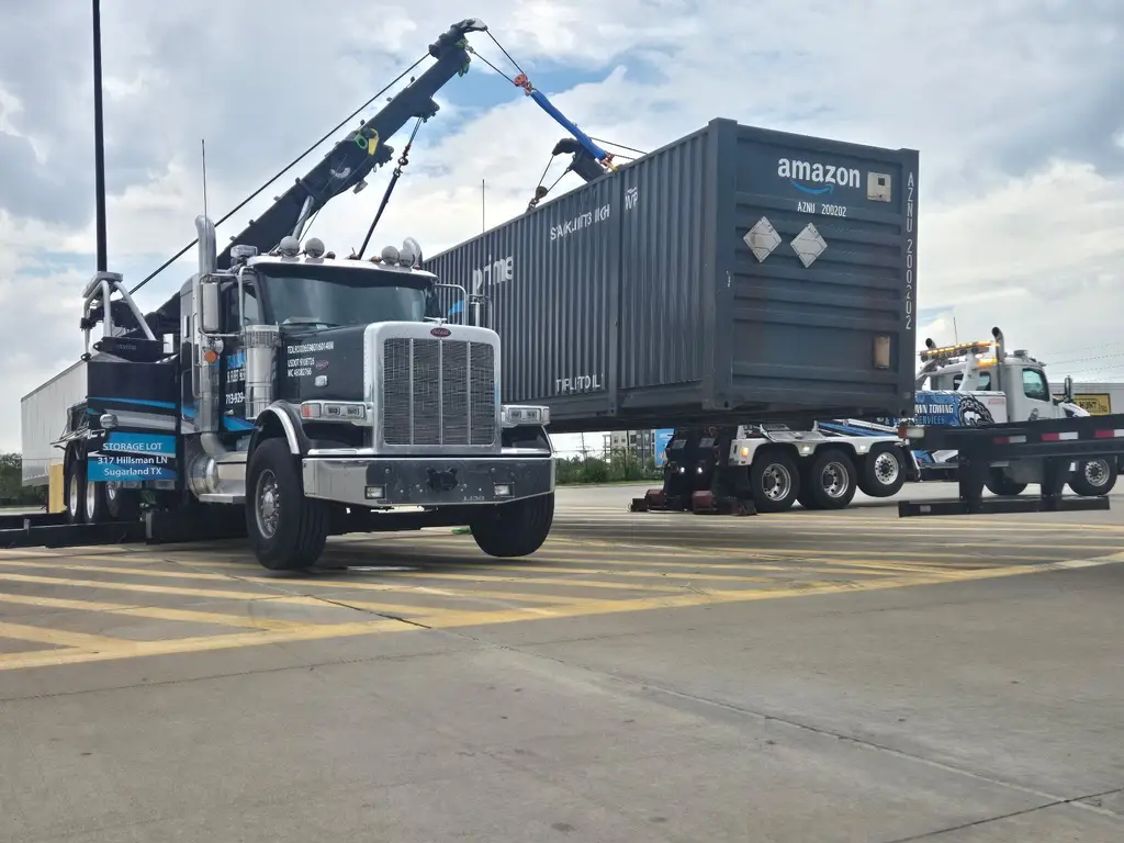 Our 50-ton rotator lifting a loaded shipping container off a chassis at a Houston-area logistics yard