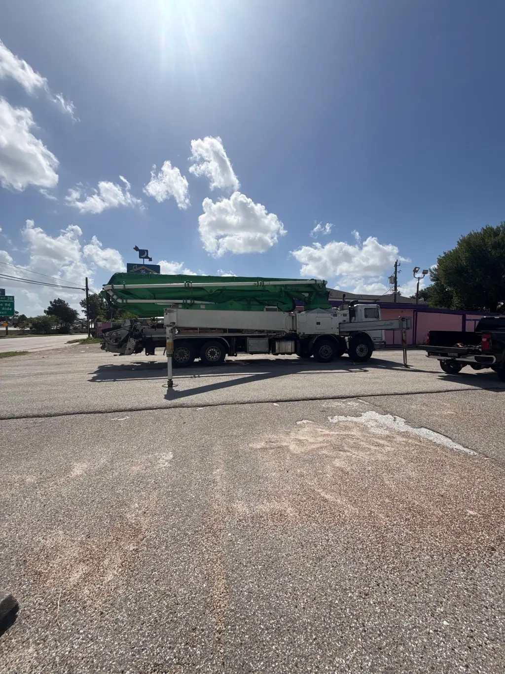 Concrete boom pump truck on the road