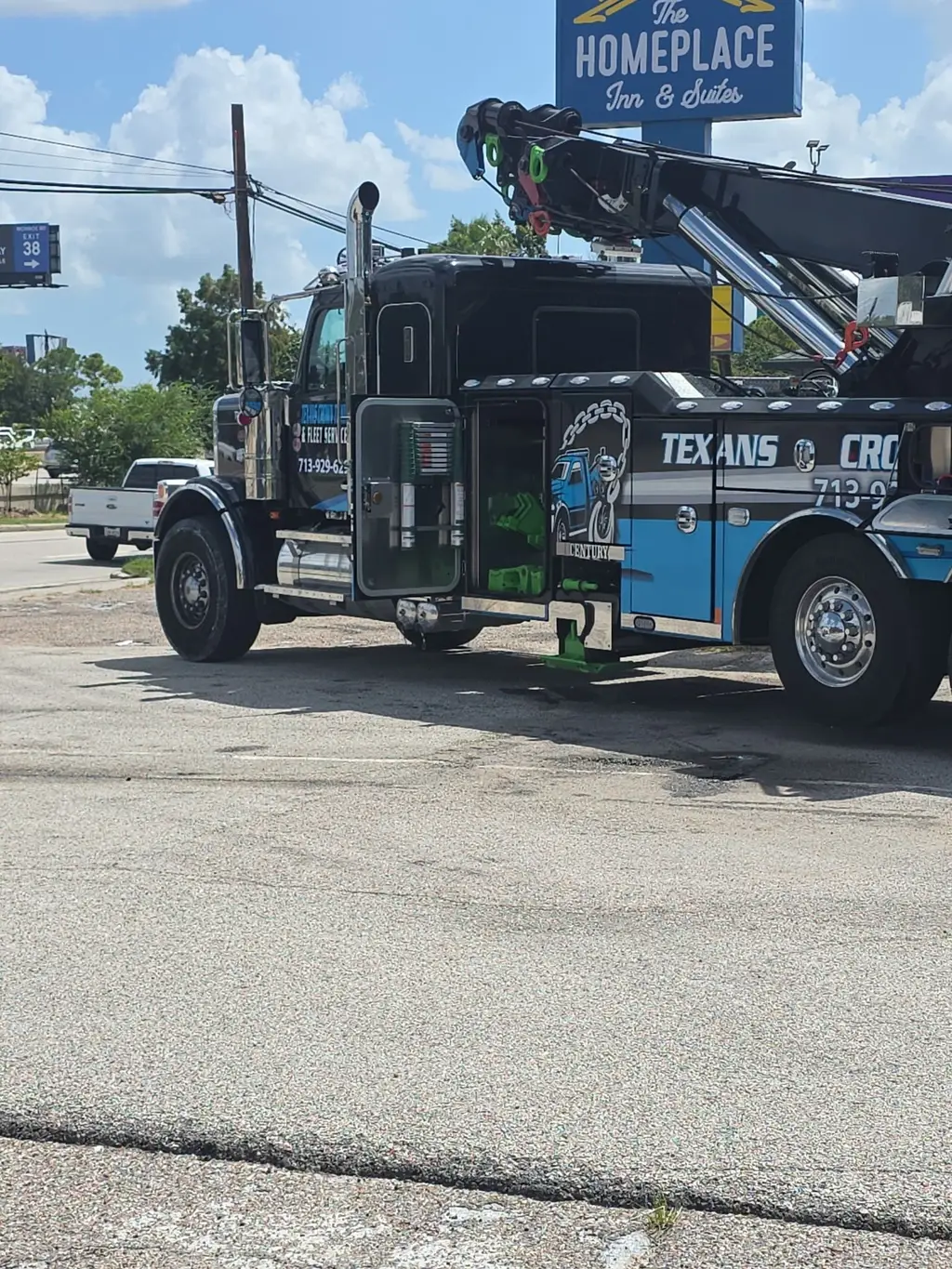 Side of the rotator body with tool compartments and company graphics